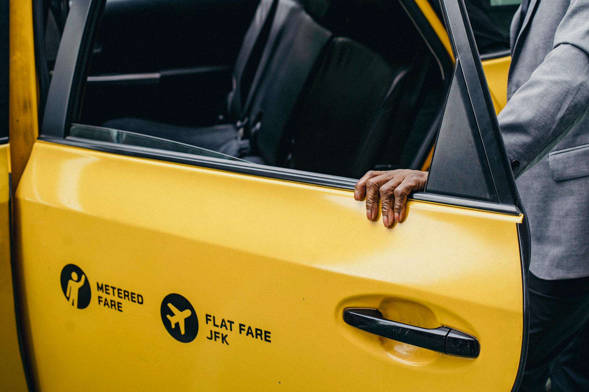 https://www.pexels.com/photo/a-person-holding-a-car-door-5647593/